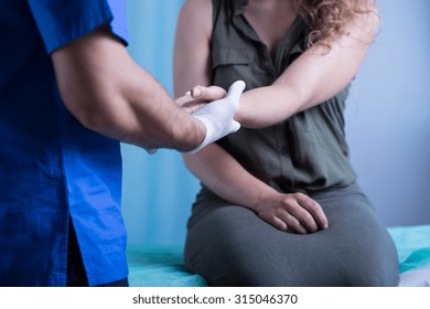 Girl with hand injury in emergency room - Powered by Shutterstock