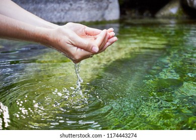 Girl hand on a river