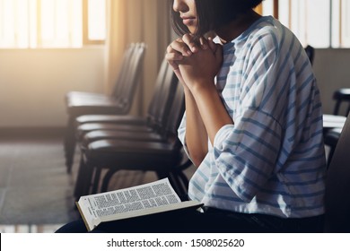 A Girl hand praying with holy bible, Girl Pray for god blessing to wishing have a better life, Christians pray from God for blessings. - Shutterstock ID 1508025620