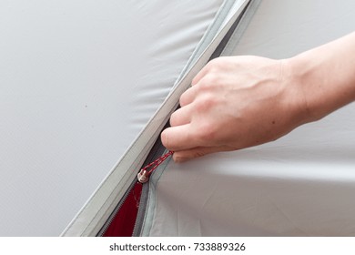 Girl Hand Unzip The Entry Of Camping Tent On Rainfly