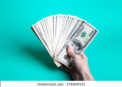 Girl Hands Holding A Batch Of Dollars
