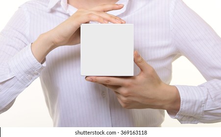 The Girl In The Hands Holding A White Box