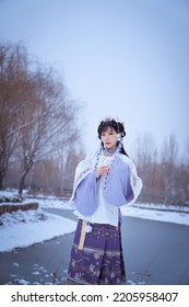 A Girl In Hanfu In The Snow