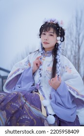 A Girl In Hanfu In The Snow