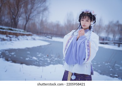 A Girl In Hanfu In The Snow