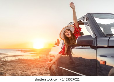 Girl With Happy Hat At Sunset On The Beach With Her Convertible Car