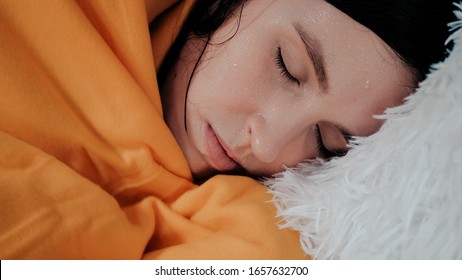 Girl Has Fever. Young Attractive Caucasian Woman Lies On Bed Of Her Shakes. Colds, Flu, Cold Sweat, Virus, Acute Respiratory Illness, Chills Concept. Close-up