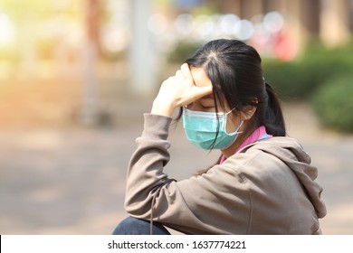 Girl has a mask to protect herself from Corona virus, woman get sick from Corona Virus, panic or stress from work or coronavirus, traveler with a mask on nose for her safety outdoor activity, illness - Shutterstock ID 1637774221