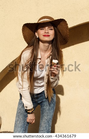 girl in the hat eating ice cream
