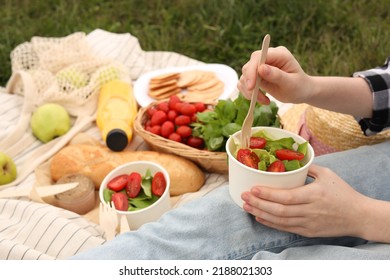 Girl Having Picnic On Green Grass In Park, Closeup