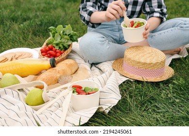 Girl Having Picnic On Green Grass In Park, Closeup