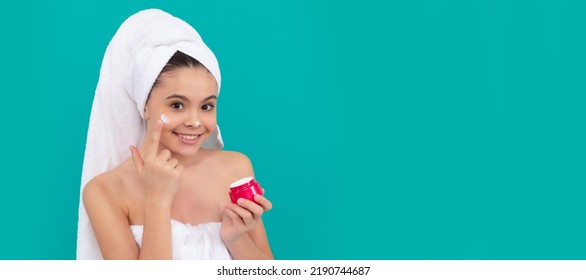 Girl With Healthy Skin, Facial Treatment, Funny Child In Bath Tower Applying Face Cream, Healthy Skin. Cosmetics And Skin Care For Teenager Child, Poster Design. Beauty Kid Girl Banner With Copy