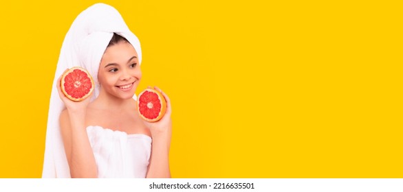 Girl With Healthy Skin, Facial Treatment, Happy Kid In Towel With Grapefruit On Yellow Background. Cosmetics And Skin Care For Teenager Child, Poster Design. Beauty Kid Girl Banner With Copy Space.