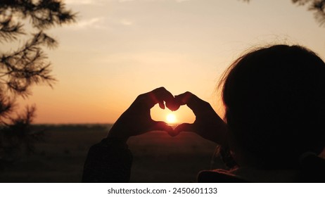 girl heart sign, sunset love symbol, hand silhouette heart, romantic gesture sunset, love hand silhouette, heart shape hands, fingers forming heart, romantic sign sunset, symbol of love sky, romantic