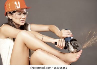 Girl With Helmet And Goggles Polished Her Nails With Power Tools