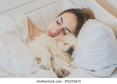 Girl And Her Dog In The Bed.