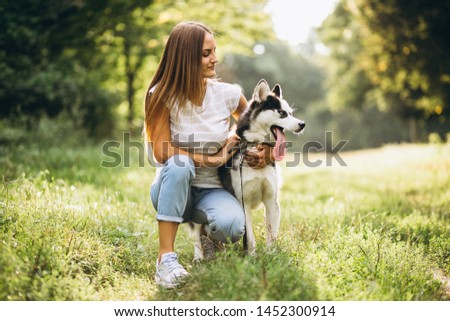 Girl with her dog in park