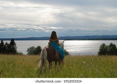 A Girl With Her Horse. View Over The Lake Storsjön In Jämtland, Sweden