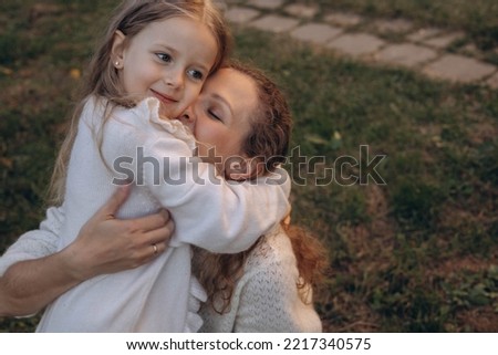 Similar – Granddaughter hugging her grandmother