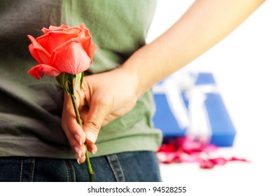 Girl hiding back red rose flower - Powered by Shutterstock