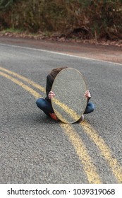 Girl Hiding Behind Mirror