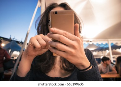 Girl Hiding Behind The Phone, Lonely Woman At Fair Using Cell