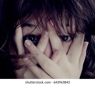 Girl hiding face hands