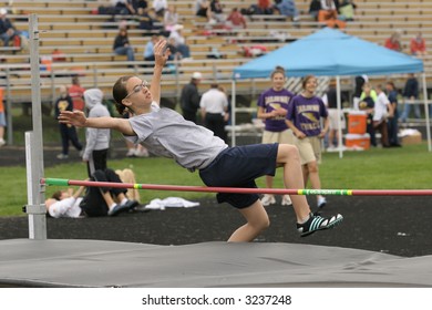 Girl High Jumping At Track Meet