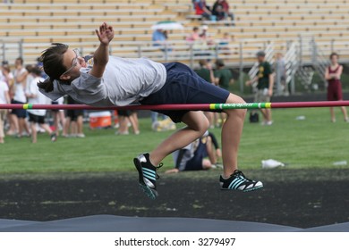 Girl High Jumping At Track Meet