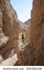 Girl Hiking In Badlands National Park Desert 