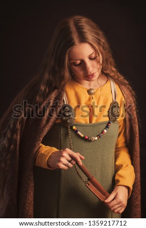 girl in the historical medieval dress of a viking woman