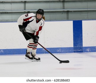 Girl Hockey Player With Puck