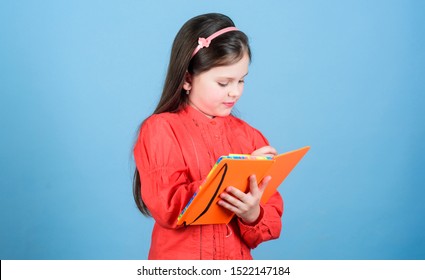 Girl Hold Book Blue Background. Kid Writing Book. Book Concept. Development And Education. Homework Exercise. Write Composition. Literature Club. Personal Diary. Study And Learn. Poetry Author.