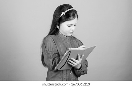 Girl Hold Book Blue Background. Kid Writing Book. Book Concept. Development And Education. Homework Exercise. Write Composition. Literature Club. Personal Diary. Study And Learn. Poetry Author.