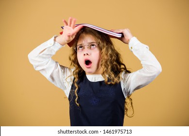 Girl Hold Textbook Folder Test. Preparing To Exams In Library. Small Child Formal Wear. Prepare For Exam. Formal Education And Homeschooling. Check Knowledge. School Exam Concept. Final Exam Coming.