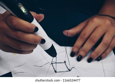 Girl Holding 3d Printing Pen And Designing A Building