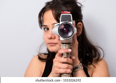 Girl Holding An 8 Mm Camera