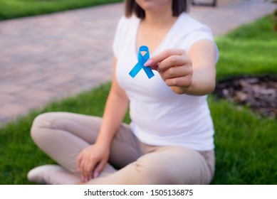 The Girl Holding A Black Ribbon, Symbol Of Cancer. Colon Awareness Month.