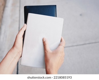 A Girl Holding Blank Book. Cover Mockup Template. 