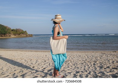 Girl Is Holding Blank Canvas Tote Bag On Beach, Woman Travelling Back View