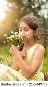 girl holding a bouquet of clover
