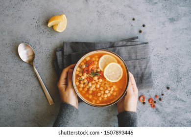 Girl Holding Bowl With Chickpea Lentil Soup. Harira Moroccan Soup. Comfortable Food In The Cold Season