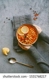 Girl Holding Bowl With Chickpea Lentil Soup. Harira Moroccan Soup. Comfortable Food In The Cold Season