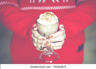 Girl holding cacao with whipped cream. Christmas holiday concept. Holiday background. Warm tone. Horizontal