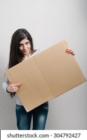 Girl Holding Cardboard For Sign