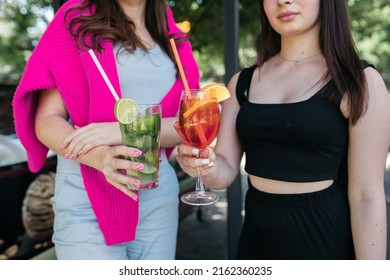 Girl Holding Cocktails In Her Hands Girl Holding Aperol And Mojito In Her Hands. Summer Time. Heat.