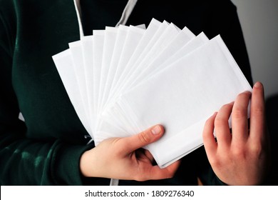 Girl Holding Envelopes Ready To Be Sent To Pen Pals 