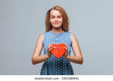 Girl holding heart gift box - Shutterstock ID 1501580441