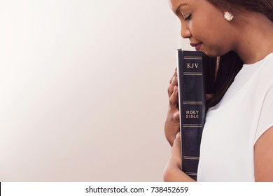 Girl Holding Her Holy King James Bible 