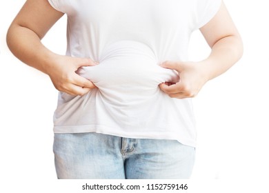 Girl Holding Her Stomach With Excess Fat. Excess Weight Of Woman. Isolated On White.